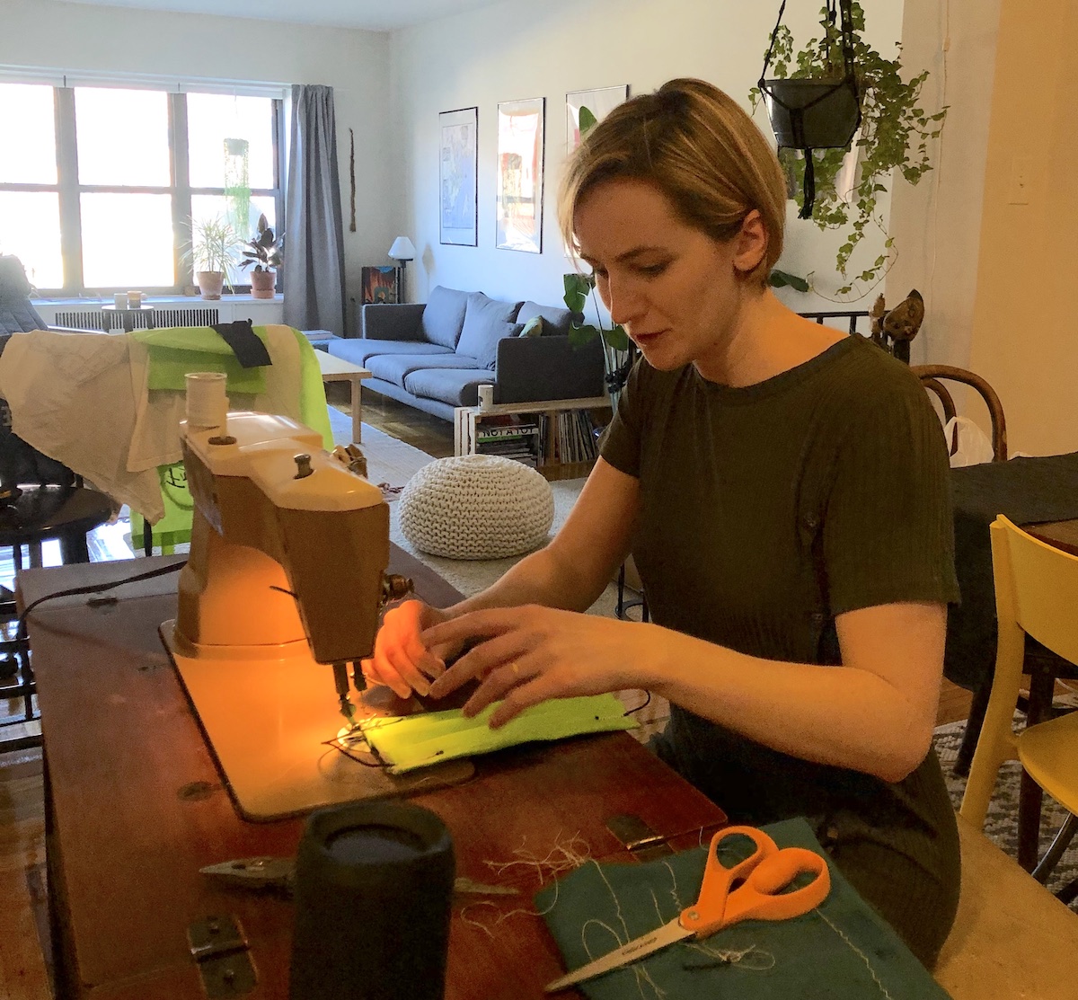 woman sewing face masks